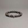 Браслет з натурального гранованого гематиту та лави з Черепом